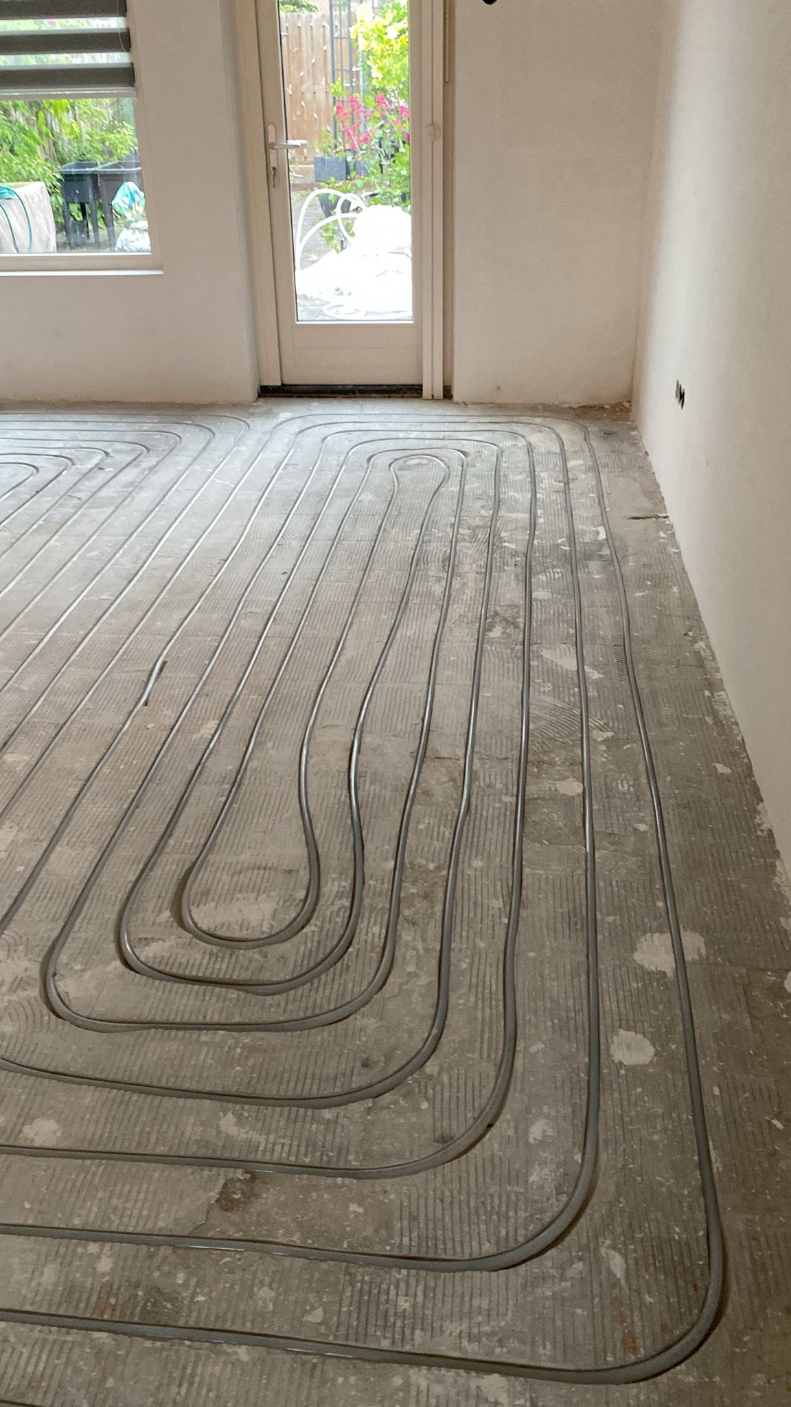 Vloerverwarming ingefreest in woonkamer